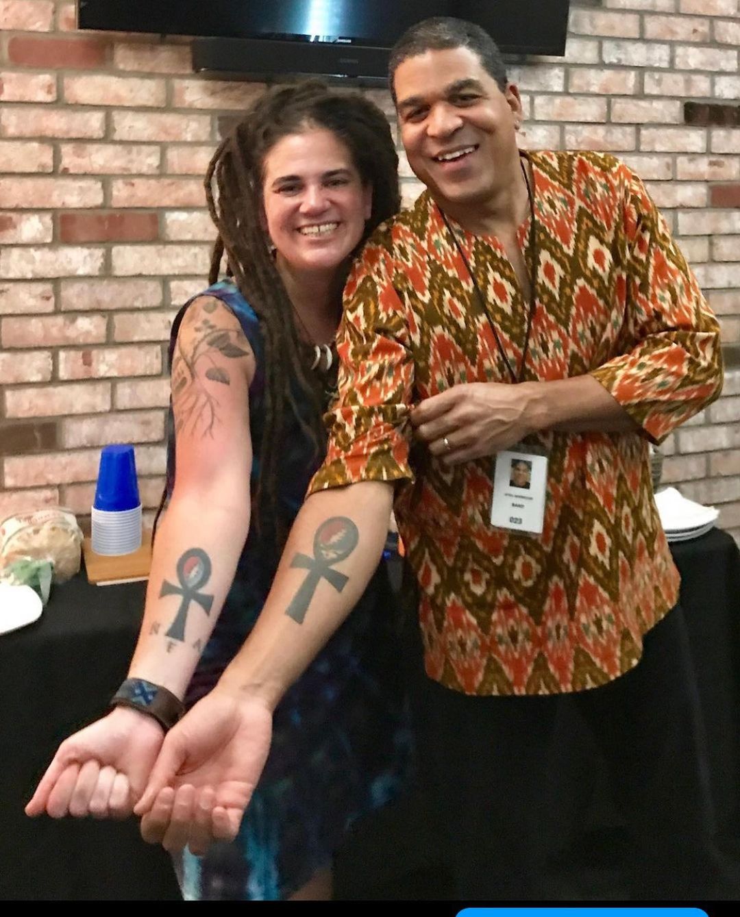 Oteil Burbridge with his friend Ripple. Both showing their matching tattoos.
